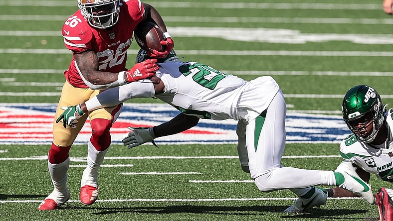 Sep 20, 2020; East Rutherford, New Jersey, USA; San Francisco 49ers running back Tevin Coleman (26) carries the ball as New York Jets free safety Marcus Maye (20) tackles during the second half at MetLife Stadium. Mandatory Credit: Vincent Carchietta-USA TODAY Sports