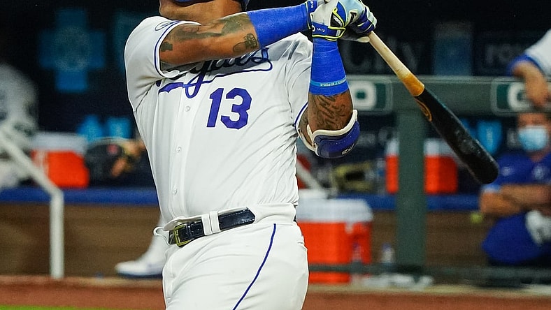 Sep 24, 2020; Kansas City, Missouri, USA; Kansas City Royals catcher Salvador Perez (13) hits a home run against the Detroit Tigers at Kauffman Stadium. Mandatory Credit: Jay Biggerstaff-USA TODAY Sports