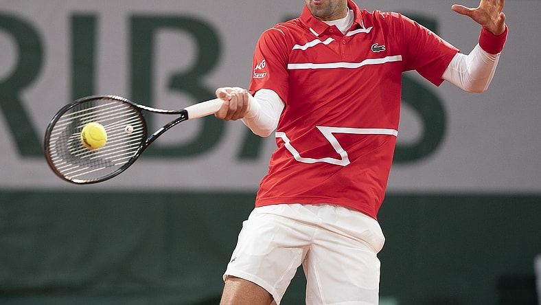 Oct 11, 2020;  Paris, France; Novak Djokovic (SRB) in action during his match against Rafael Nadal (ESP) on day 15 at Stade Roland Garros. Mandatory Credit: Susan Mullane-USA TODAY Sports