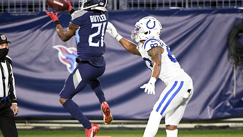 Nov 12, 2020; Nashville, Tennessee, USA; Tennessee Titans cornerback Malcolm Butler (21) makes the interception in front of Indianapolis Colts wide receiver Marcus Johnson (83) but ruled out of bounds during the second half at Nissan Stadium. Mandatory Credit: Steve Roberts-USA TODAY Sports