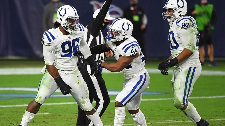 Nov 12, 2020; Nashville, Tennessee, USA; Indianapolis Colts defensive tackle Denico Autry (96) celebrates a sack with Indianapolis Colts middle linebacker Anthony Walker (54) and Indianapolis Colts defensive tackle Grover Stewart (90) during the second half against the Tennessee Titans at Nissan Stadium. Mandatory Credit: Christopher Hanewinckel-USA TODAY Sports