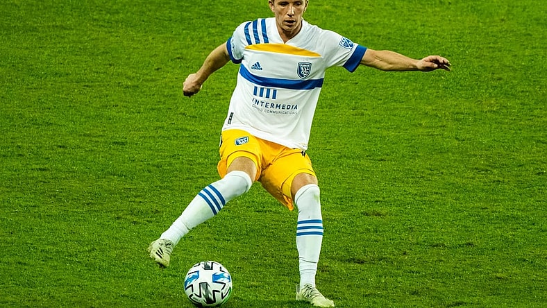 Nov 22, 2020; Kansas City, Kansas, USA; San Jose Earthquakes midfielder Jackson Yueill (14) controls the ball against Sporting Kansas City during extra time at Children's Mercy Park. Mandatory Credit: Jay Biggerstaff-USA TODAY Sports