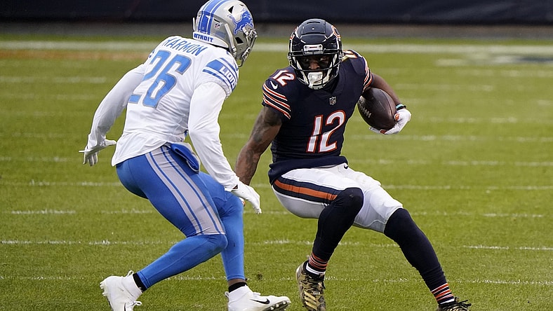 Dec 6, 2020; Chicago, Illinois, USA; Chicago Bears wide receiver Allen Robinson (12) makes a catch against Detroit Lions strong safety Duron Harmon (26) during the second quarter at Soldier Field. Mandatory Credit: Mike Dinovo-USA TODAY Sports