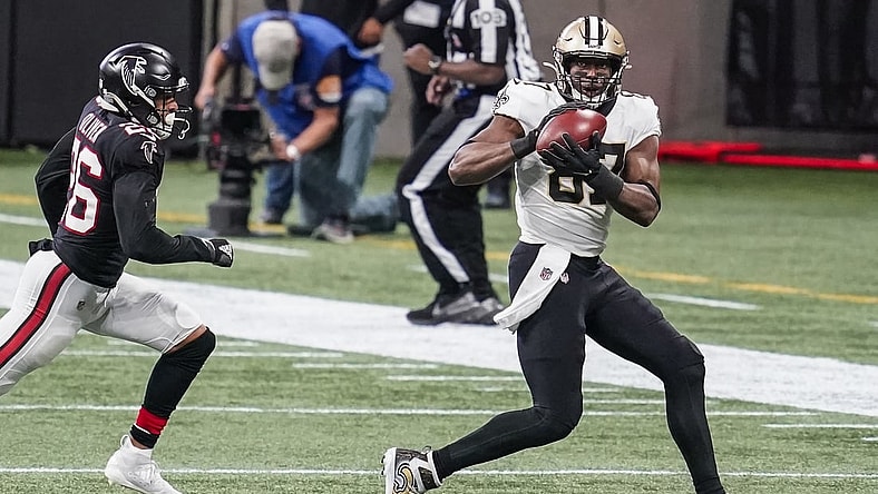 Dec 6, 2020; Atlanta, Georgia, USA; New Orleans Saints tight end Jared Cook (87) makes a catch in front of Atlanta Falcons cornerback Isaiah Oliver (26) during the second half at Mercedes-Benz Stadium. Mandatory Credit: Dale Zanine-USA TODAY Sports