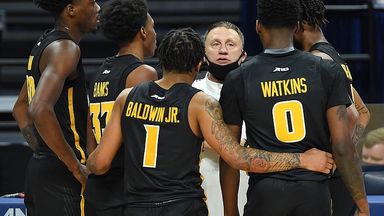 Dec 2, 2020; University Park, Pennsylvania, USA; Virginia Commonwealth Rams head coach Mike Rhoades talks with his team during a time-out in the second half against the Penn State Nittany Lions at the Bryce Jordan Center. Mandatory Credit: Rich Barnes-USA TODAY Sports