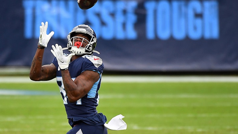 Dec 20, 2020; Nashville, Tennessee, USA; Tennessee Titans wide receiver Corey Davis (84) catches a 75-yard touchdown pass against the Detroit Lions during the first half at Nissan Stadium. Mandatory Credit: Christopher Hanewinckel-USA TODAY Sports