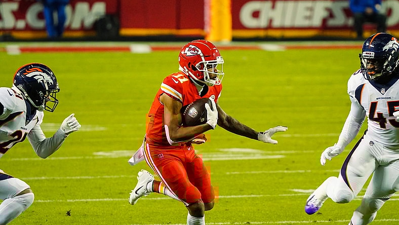 Dec 6, 2020; Kansas City, Missouri, USA; Kansas City Chiefs wide receiver Demarcus Robinson (11) runs against Denver Broncos cornerback A.J. Bouye (21) and inside linebacker A.J. Johnson (45) during the first half at Arrowhead Stadium. Mandatory Credit: Jay Biggerstaff-USA TODAY Sports