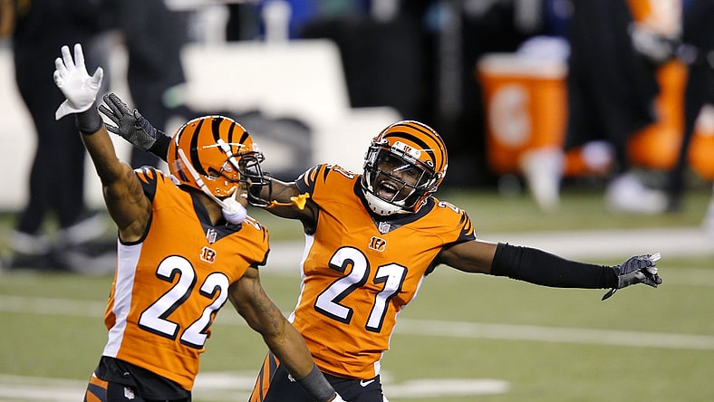 Dec 21, 2020; Cincinnati, Ohio, USA; Cincinnati Bengals cornerback Mackensie Alexander (21) and cornerback William Jackson (22) celebrate as the time winds down on the upset win over Pittsburgh Steelers at Paul Brown Stadium. Mandatory Credit: Joseph Maiorana-USA TODAY Sports