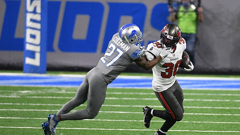 Dec 26, 2020; Detroit, Michigan, USA; Tampa Bay Buccaneers running back Ke Shawn Vaughn (30) runs the ball against Detroit Lions cornerback Justin Coleman (27) at Ford Field. Mandatory Credit: Tim Fuller-USA TODAY Sports