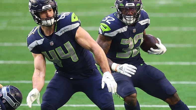 Jan 3, 2021; Glendale, Arizona, USA; Seattle Seahawks fullback Nick Bellore (44) blocks for running back Chris Carson (32) against the San Francisco 49ers at State Farm Stadium. Mandatory Credit: Mark J. Rebilas-USA TODAY Sports