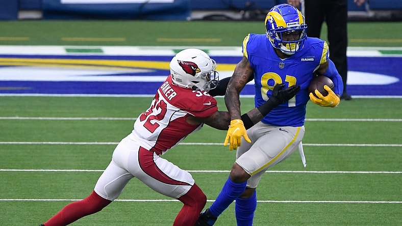 Jan 3, 2021; Inglewood, California, USA; Arizona Cardinals strong safety Budda Baker (32) tackles Los Angeles Rams tight end Gerald Everett (81) during the second half at SoFi Stadium. Mandatory Credit: Robert Hanashiro-USA TODAY Sports