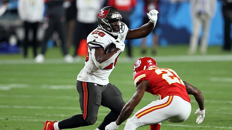 Feb 7, 2021; Tampa, FL, USA;  Tampa Bay Buccaneers running back Leonard Fournette (28) runs the ball against Kansas City Chiefs cornerback Bashaud Breeland (21) during the fourth quarter in Super Bowl LV at Raymond James Stadium.  Mandatory Credit: Matthew Emmons-USA TODAY Sports