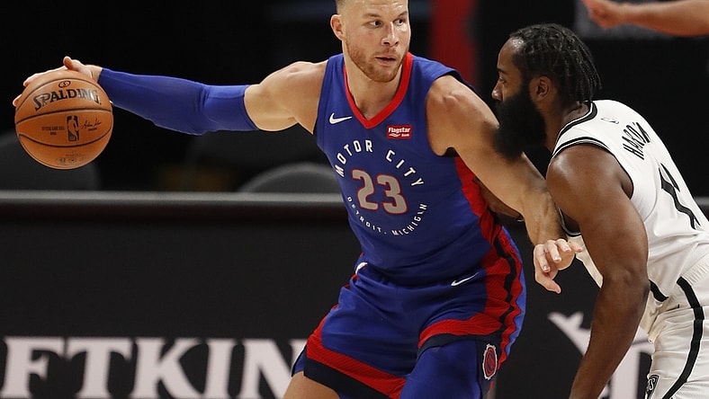 Feb 9, 2021; Detroit, Michigan, USA; Detroit Pistons forward Blake Griffin (23) controls the ball while defended by Brooklyn Nets guard James Harden (R) during the first quarter at Little Caesars Arena. Mandatory Credit: Raj Mehta-USA TODAY Sports