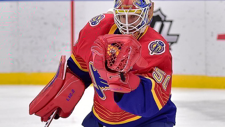 Feb 22, 2021; St. Louis, Missouri, USA;  St. Louis Blues goaltender Jordan Binnington (50) makes a glove save during the second period against the Los Angeles Kings at Enterprise Center. Mandatory Credit: Jeff Curry-USA TODAY Sports