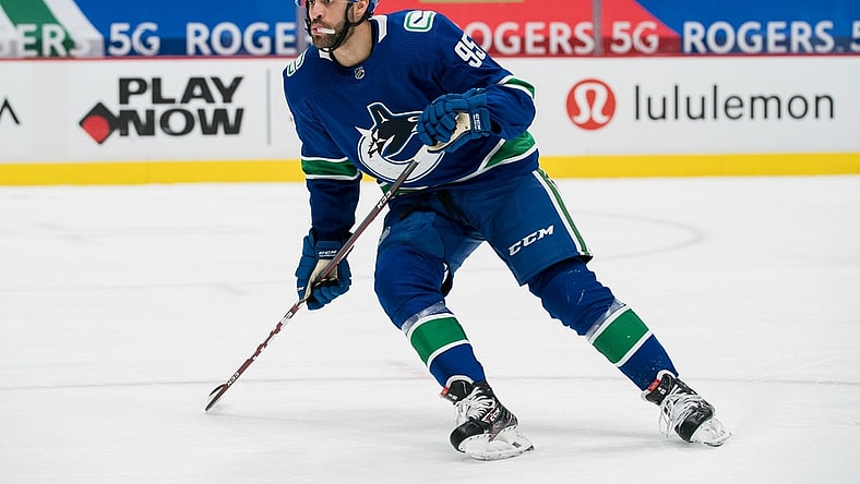 Feb 11, 2021; Vancouver, British Columbia, CAN; Vancouver Canucks forward Justin Bailey (95) skates against the Calgary Flames in the third period at Rogers Arena. Calgary won 3-1. Mandatory Credit: Bob Frid-USA TODAY Sports