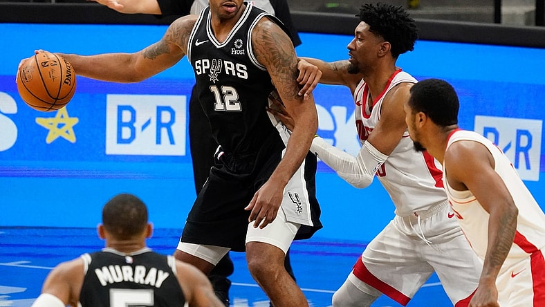Jan 14, 2021; San Antonio, Texas, USA; San Antonio Spurs forward LaMarcus Aldridge (12) post up against Houston Rockets center Christian Wood (35) in the third quarter at AT&T Center. Mandatory Credit: Scott Wachter-USA TODAY Sports