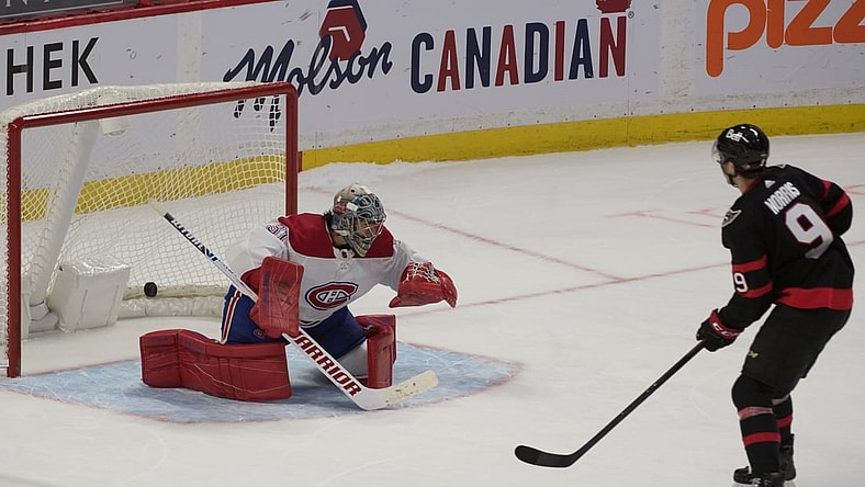 Feb 23, 2021; Ottawa, Ontario, CAN; Ottawa Senators center Josh Norris (9) scores against Montreal Canadiens goalie Carey Price (31) in a shootout at the Canadian Tire Centre. Mandatory Credit: Marc DesRosiers-USA TODAY Sports