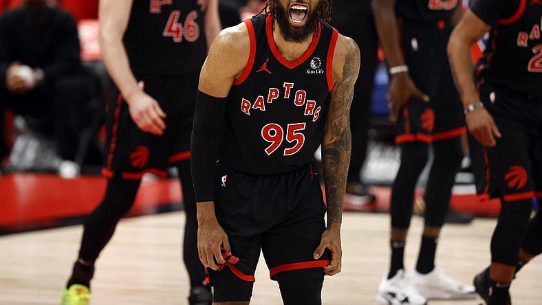 Feb 23, 2021; Tampa, Florida, USA; Toronto Raptors forward DeAndre' Bembry (95) reacts against the Philadelphia 76ers during the second half at Amalie Arena. Mandatory Credit: Kim Klement-USA TODAY Sports