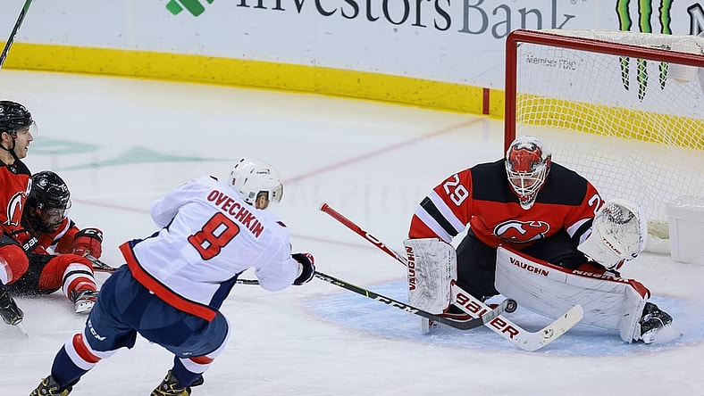 Feb 28, 2021; Newark, New Jersey, USA; New Jersey Devils goaltender Mackenzie Blackwood (29) blocks a shot by Washington Capitals left wing Alex Ovechkin (8) during the first period at Prudential Center. Mandatory Credit: Vincent Carchietta-USA TODAY Sports