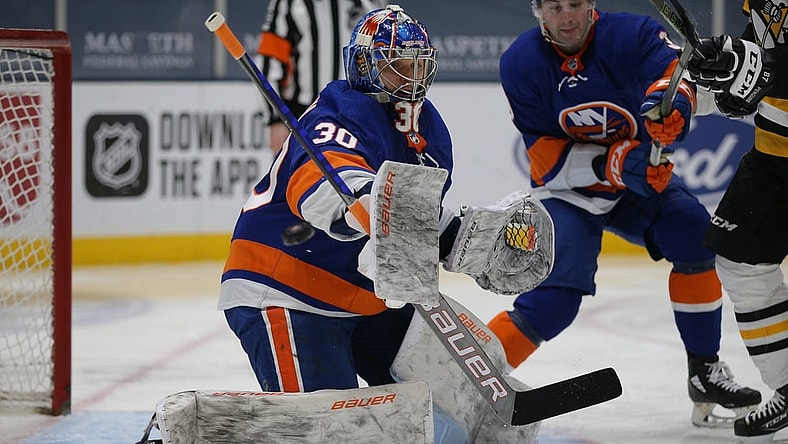 Feb 28, 2021; Uniondale, New York, USA; New York Islanders goalie Ilya Sorokin (30) makes a save against the Pittsburgh Penguins during the third period at Nassau Veterans Memorial Coliseum. Mandatory Credit: Brad Penner-USA TODAY Sports