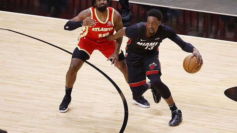 Feb 28, 2021; Miami, Florida, USA; Atlanta Hawks forward Solomon Hill (18) defends Miami Heat center Bam Adebayo (13) during the first half at American Airlines Arena. Mandatory Credit: Rhona Wise-USA TODAY Sports