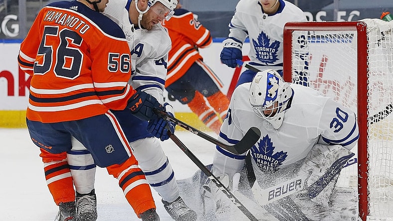 Mar 1, 2021; Edmonton, Alberta, CAN; Toronto Maple Leafs goaltender Michael Hutchinson (30) makes a save against Edmonton Oilers forward Kailer Yamamoto (56) during the first period at Rogers Place. Mandatory Credit: Perry Nelson-USA TODAY Sports
