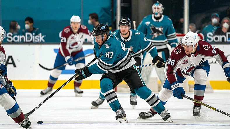 Mar 1, 2021; San Jose, California, USA; San Jose Sharks defenseman Christian Jaros (83) controls the puck against Colorado Avalanche right wing Mikko Rantanen (96) during the first period at SAP Center at San Jose. Mandatory Credit: Neville E. Guard-USA TODAY Sports
