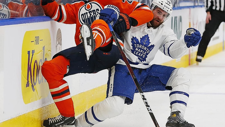 Mar 1, 2021; Edmonton, Alberta, CAN; Toronto Maple Leafs defensemen T.J. Brodie (78) and Edmonton Oilers forward Leon Draisaitl (29) play for the puck during the third period at Rogers Place. Mandatory Credit: Perry Nelson-USA TODAY Sports