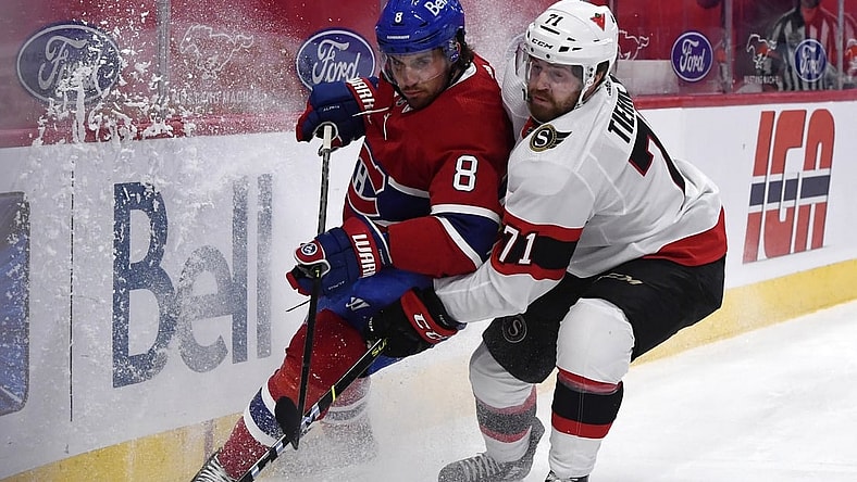 Mar 2, 2021; Montreal, Quebec, CAN; Montreal Canadiens defenseman Ben Chiarot (8) and Ottawa Senators forward Chris Tierney (71) battle for the puck during the first period at the Bell Centre. Mandatory Credit: Eric Bolte-USA TODAY Sports