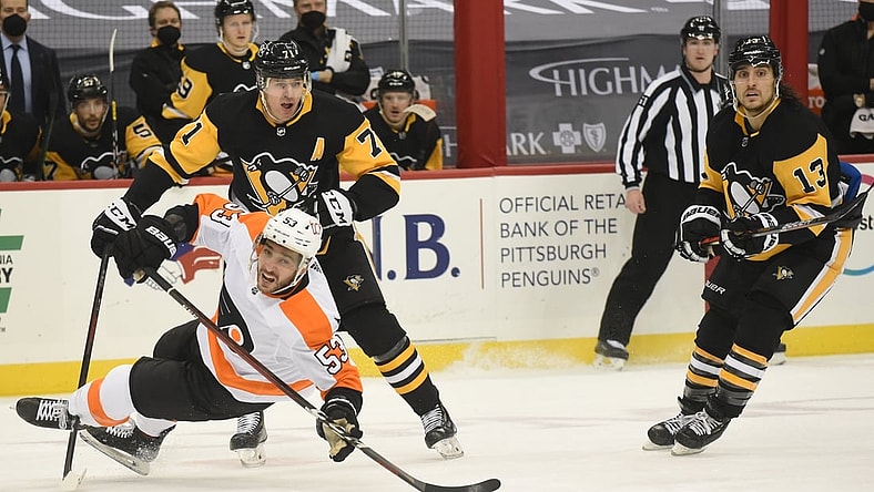 Mar 2, 2021; Pittsburgh, Pennsylvania, USA; Philadelphia Flyers defender Shayne Gostisbehere (53) is knocked down by Pittsburgh Penguins center Evgeni Malkin (71) during the first period at PPG Paints Arena. Mandatory Credit: Philip G. Pavely-USA TODAY Sports
