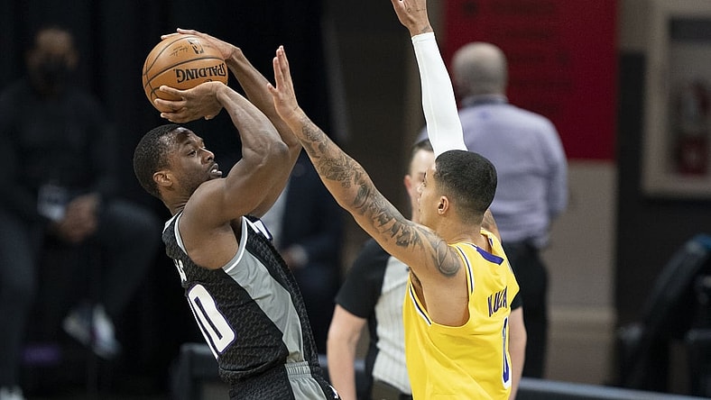 March 3, 2021; Sacramento, California, USA; Sacramento Kings forward Harrison Barnes (40) shoots the basketball against Los Angeles Lakers forward Kyle Kuzma (0)  during the first quarter at Golden 1 Center. Mandatory Credit: Kyle Terada-USA TODAY Sports