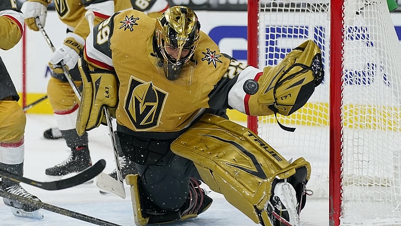 Mar 3, 2021; Las Vegas, Nevada, USA; Vegas Golden Knights goaltender Marc-Andre Fleury (29) blocks a shot by the Minnesota Wild during the first period of an NHL hockey game Wednesday, March 3, 2021, in Las Vegas.   Mandatory Credit:  John Locher-POOL PHOTOS-USA TODAY Sports