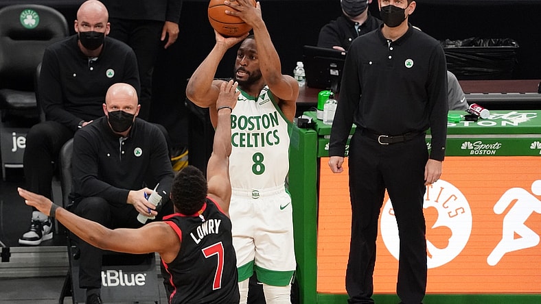 Mar 4, 2021; Boston, Massachusetts, USA; Boston Celtics guard Kemba Walker (8) shoots against Toronto Raptors guard Kyle Lowry (7) in the second quarter at TD Garden. Mandatory Credit: David Butler II-USA TODAY Sports