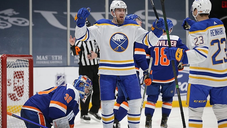 Mar 4, 2021; Uniondale, New York, USA; Buffalo Sabres defenseman Rasmus Ristolainen (55) celebrates with center Sam Reinhart (23) after scoring a goal against New York Islanders goalie Ilya Sorokin (30) during the third period at Nassau Veterans Memorial Coliseum. Mandatory Credit: Brad Penner-USA TODAY Sports