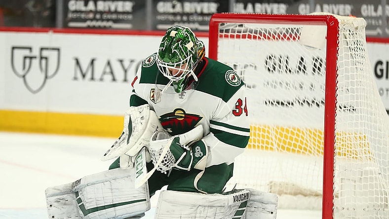 Mar 5, 2021; Glendale, Arizona, USA; Minnesota Wild goaltender Kaapo Kahkonen (34) blocks a shot against the Arizona Coyotes during the second period at Gila River Arena. Mandatory Credit: Mark J. Rebilas-USA TODAY Sports