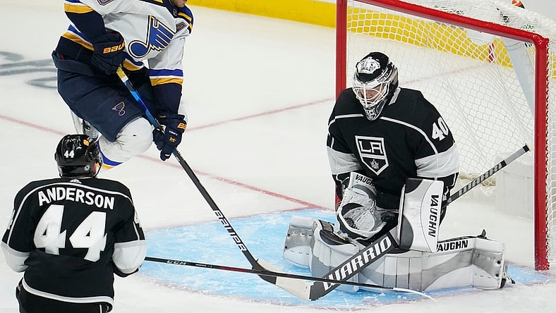 Mar 5, 2021; Los Angeles, California, USA; Los Angeles Kings goaltender Calvin Petersen (40) makes a save as St. Louis Blues center Brayden Schenn (10) jumps out of the way during the third period at Staples Center. Mandatory Credit: Robert Hanashiro-USA TODAY Sports