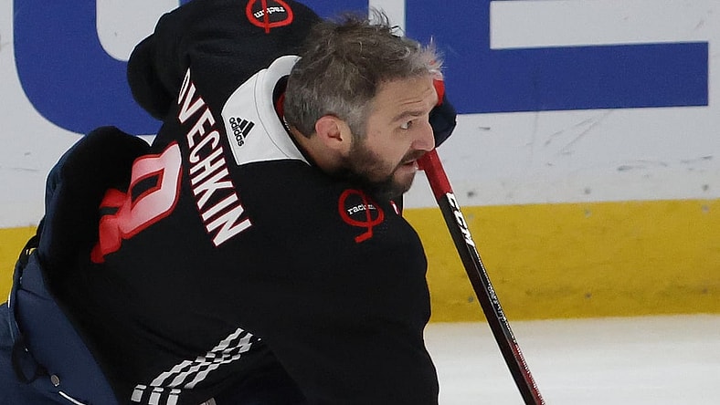 Feb 25, 2021; Washington, District of Columbia, USA; Washington Capitals left wing Alex Ovechkin (8) shoots during warmups in a warmup jersey observing Capitals Black History Night prior to their game against the Pittsburgh Penguins at Capital One Arena. Mandatory Credit: Geoff Burke-USA TODAY Sports