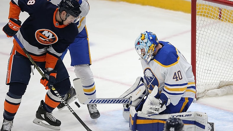 Mar 6, 2021; Uniondale, New York, USA; Buffalo Sabres goalie Carter Hutton (40) makes a save against New York Islanders left wing Michael Dal Colle (28) during the first period at Nassau Veterans Memorial Coliseum. Mandatory Credit: Brad Penner-USA TODAY Sports