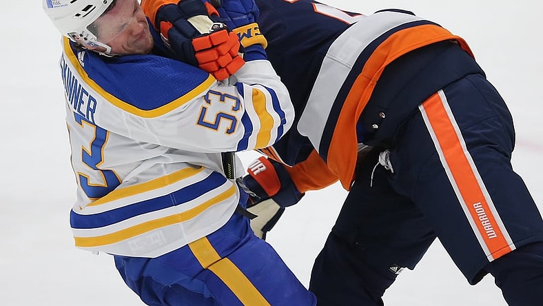 Mar 6, 2021; Uniondale, New York, USA; Buffalo Sabres left wing Jeff Skinner (53) is hit by New York Islanders defenseman Scott Mayfield (24) during the second period at Nassau Veterans Memorial Coliseum. Mandatory Credit: Brad Penner-USA TODAY Sports