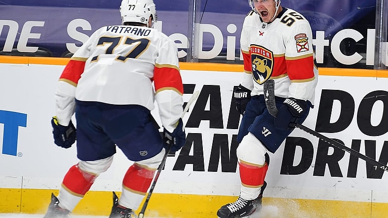 Mar 6, 2021; Nashville, Tennessee, USA; Florida Panthers center Noel Acciari (55) celebrates with center Frank Vatrano (77) after a second period goal against the Nashville Predators at Bridgestone Arena. Mandatory Credit: Christopher Hanewinckel-USA TODAY Sports