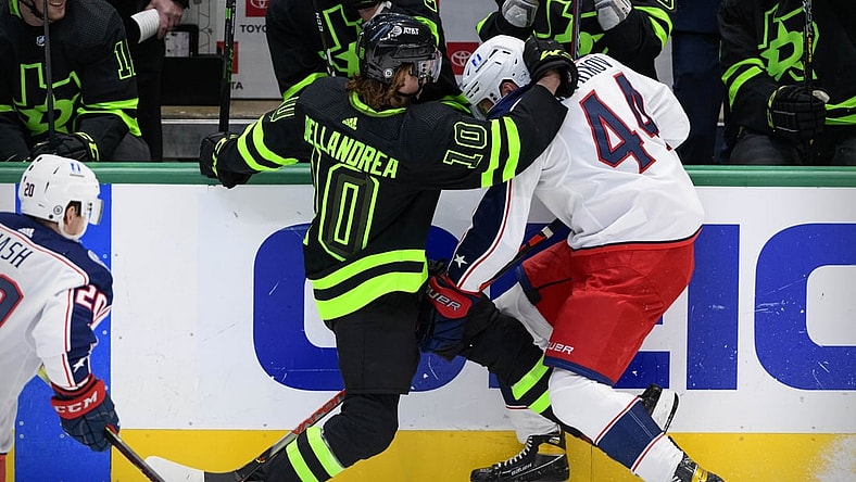 Mar 6, 2021; Dallas, Texas, USA; Dallas Stars center Ty Dellandrea (10) checks Columbus Blue Jackets defenseman Vladislav Gavrikov (44) during the first period at the American Airlines Center. Mandatory Credit: Jerome Miron-USA TODAY Sports