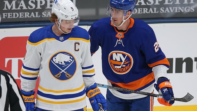 Mar 7, 2021; Uniondale, New York, USA; New York Islanders center Brock Nelson (29) talks to Buffalo Sabres center Jack Eichel (9) during the second period at Nassau Veterans Memorial Coliseum. Mandatory Credit: Brad Penner-USA TODAY Sports