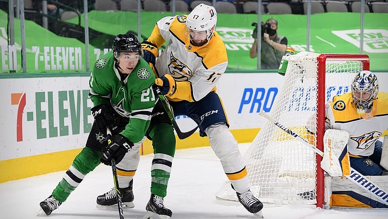 Mar 7, 2021; Dallas, Texas, USA; Nashville Predators defenseman Ben Harpur (17) defends against Dallas Stars left wing Jason Robertson (21) during the second period at the American Airlines Center. Mandatory Credit: Jerome Miron-USA TODAY Sports