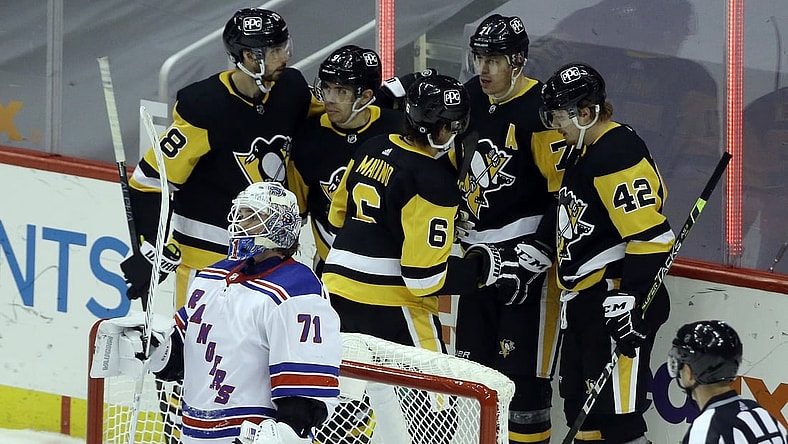 Mar 7, 2021; Pittsburgh, Pennsylvania, USA;  The Pittsburgh Penguins celebrate a goal by center Evgeni Malkin (71) against New York Rangers goaltender Keith Kinkaid (71) during the third period at PPG Paints Arena. The Penguins won 5-1. Mandatory Credit: Charles LeClaire-USA TODAY Sports