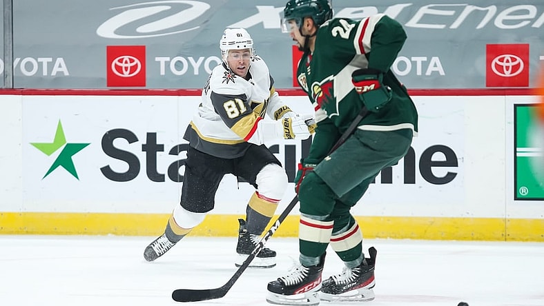 Mar 8, 2021; Saint Paul, Minnesota, USA; Vegas Golden Knights center Jonathan Marchessault (81) shoots the puck while Minnesota Wild defenseman Matt Dumba (24) defends in the first period at Xcel Energy Center. Mandatory Credit: David Berding-USA TODAY Sports