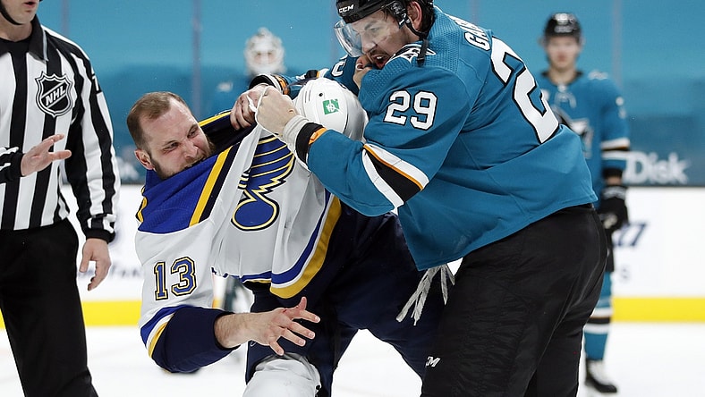 Mar 8, 2021; San Jose, California, USA; St. Louis Blues left wing Kyle Clifford (13) and San Jose Sharks right wing Kurtis Gabriel (29) fight during the first period at SAP Center at San Jose. Mandatory Credit: Darren Yamashita-USA TODAY Sports