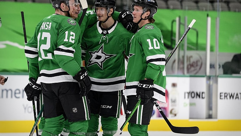 Mar 9, 2021; Dallas, Texas, USA; Dallas Stars right wing Denis Gurianov (34) and center Radek Faksa (12) and defenseman John Klingberg (3) and center Ty Dellandrea (10) celebrates a goal scored by Klingberg against the Chicago Blackhawks during the second period at the American Airlines Center. Mandatory Credit: Jerome Miron-USA TODAY Sports