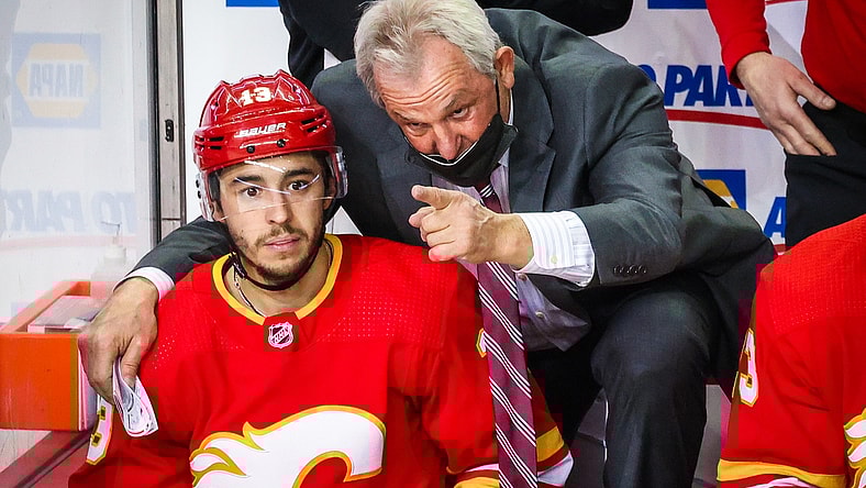 Mar 13, 2021; Calgary, Alberta, CAN; Calgary Flames head coach Darryl Sutter on his bench with left wing Johnny Gaudreau (13) during the third period against the Montreal Canadiens at Scotiabank Saddledome. Mandatory Credit: Sergei Belski-USA TODAY Sports