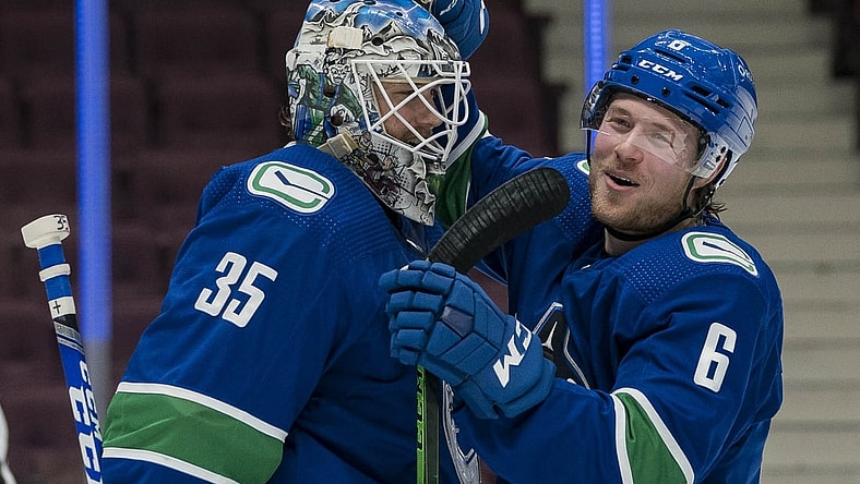 Mar 13, 2021; Vancouver, British Columbia, CAN; Vancouver Canucks goalie Thatcher Demko (35) and forward Brock Boeser (6) celebrate the Canucks victory over the Edmonton Oilers at Rogers Arena. Mandatory Credit: Bob Frid-USA TODAY Sports