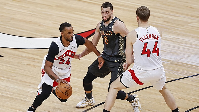 Mar 14, 2021; Chicago, Illinois, USA; Toronto Raptors guard Norman Powell (24) drives to the basket against Chicago Bulls guard Zach LaVine (8) during the second half of an NBA game at United Center. Mandatory Credit: Kamil Krzaczynski-USA TODAY Sports